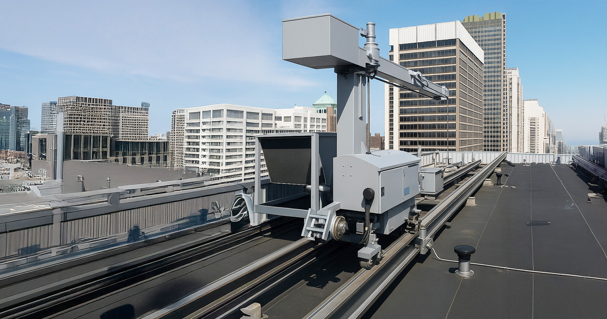 Dakwagen op een railsysteem op het dak voor veilig gevelonderhoud aan hoge gebouwen.